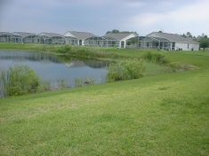 Lawns leading down to the lake at the back of the villa